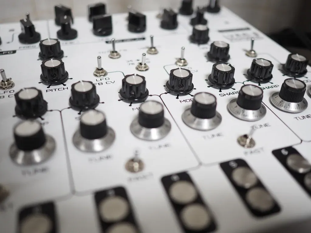 Close-up of synthesizer knobs and switches